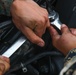 Marines with 5th Marine Regiment prepare vehicles for inspection