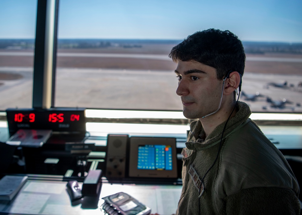 Air Traffic Control Airmen monitor, communicate with aircraft