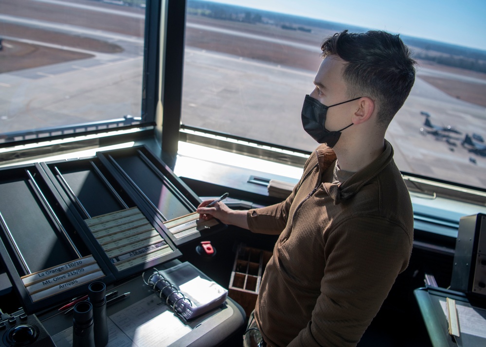 Air Traffic Control Airmen monitor, communicate with aircraft