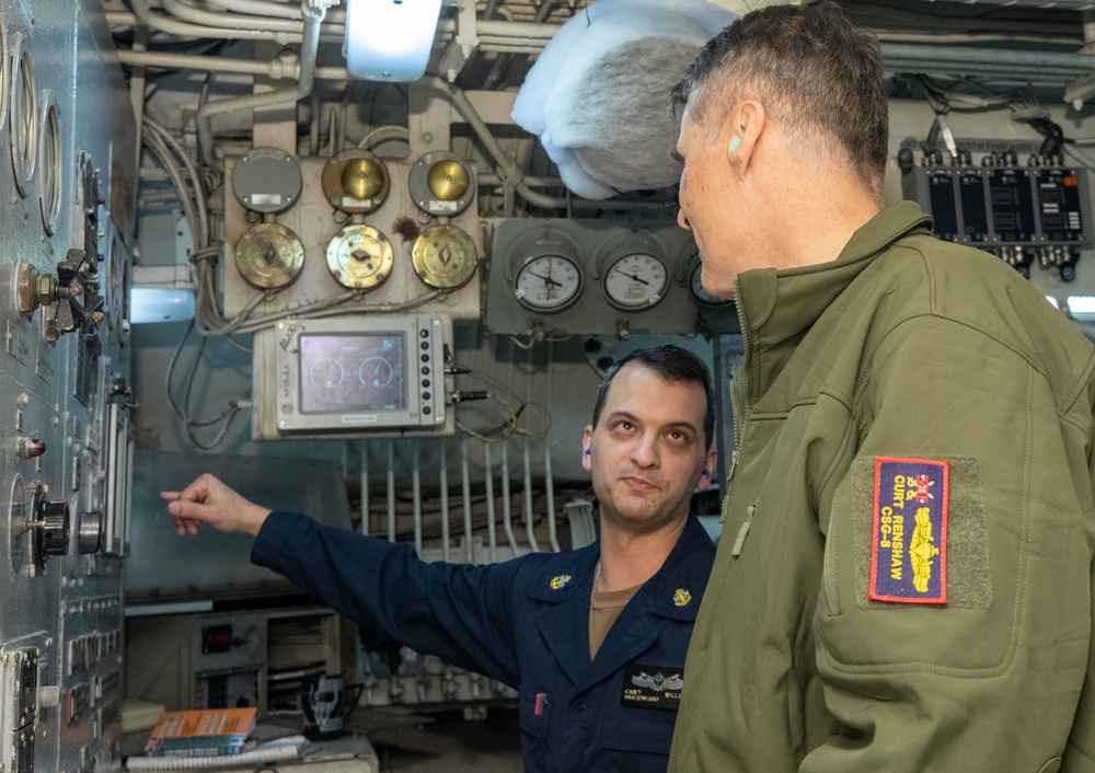 Rear Adm. Curt Renshaw, commander, Carrier Strike Group Eight, tours engineering department spaces.