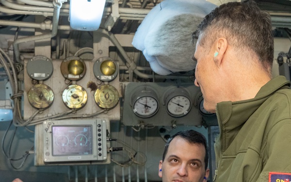 Rear Adm. Curt Renshaw, commander, Carrier Strike Group Eight, tours engineering department spaces.