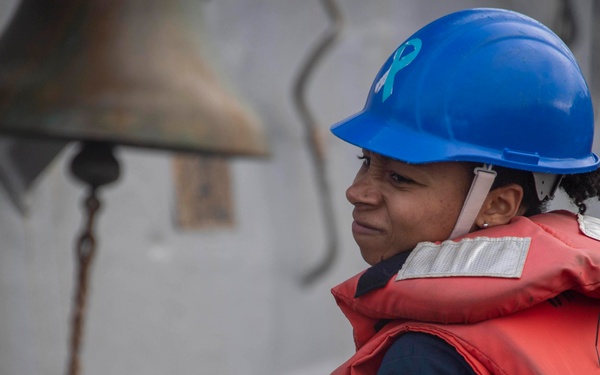 Sailor heaves on line