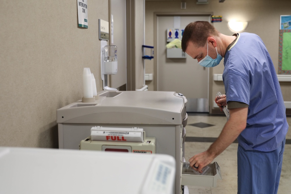 U.S. Air Force nurse retrieves patients' medicine