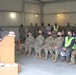 Col. Travis Rayfield addresses assembled group at groundbreaking at Whiteman AFB