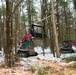 Forestry heavy equipment operators clearing hanging branches