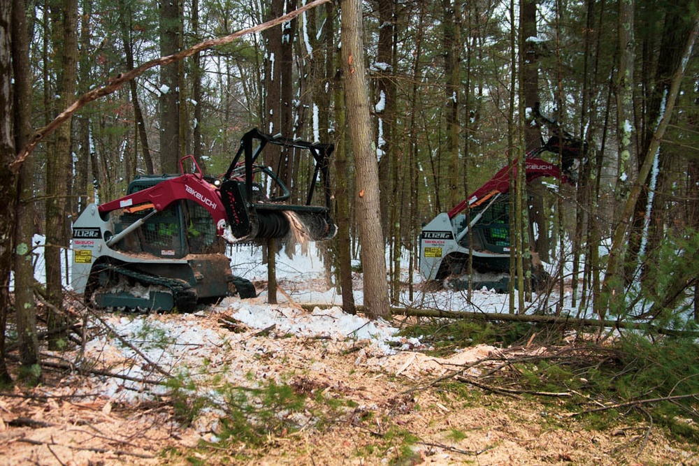 Forestry heavy equipment operators conducting thinning operations