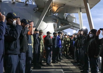 Sailors are rung off USS Ross