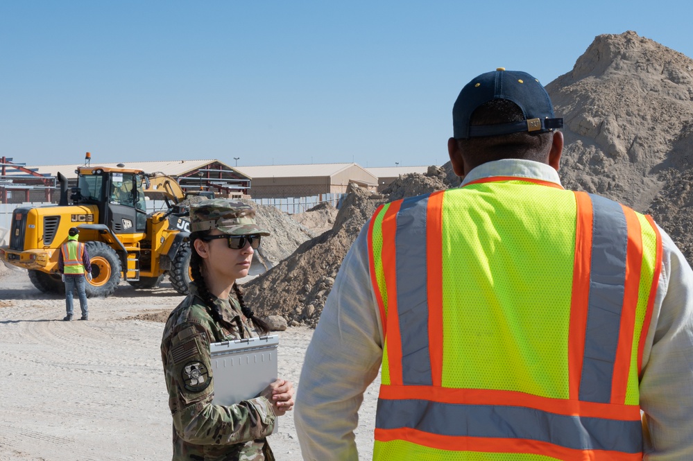 The referees of construction: 386th Expeditionary Contracting Squadron surveys new dorms