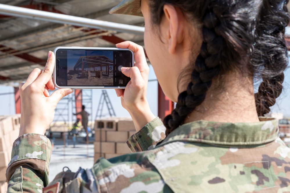 The referees of construction: 386th Expeditionary Contracting Squadron surveys new dorms