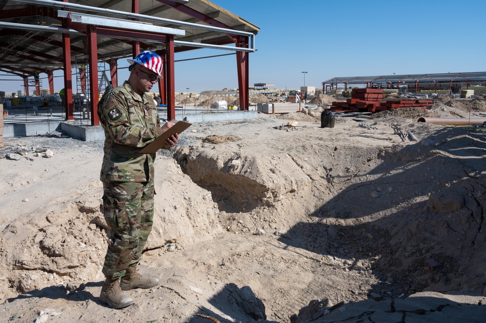 The referees of construction: 386th Expeditionary Contracting Squadron surveys new dorms