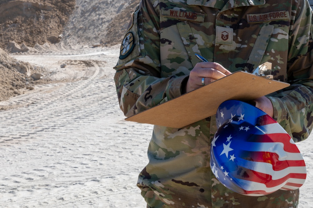 The referees of construction: 386th Expeditionary Contracting Squadron surveys new dorms