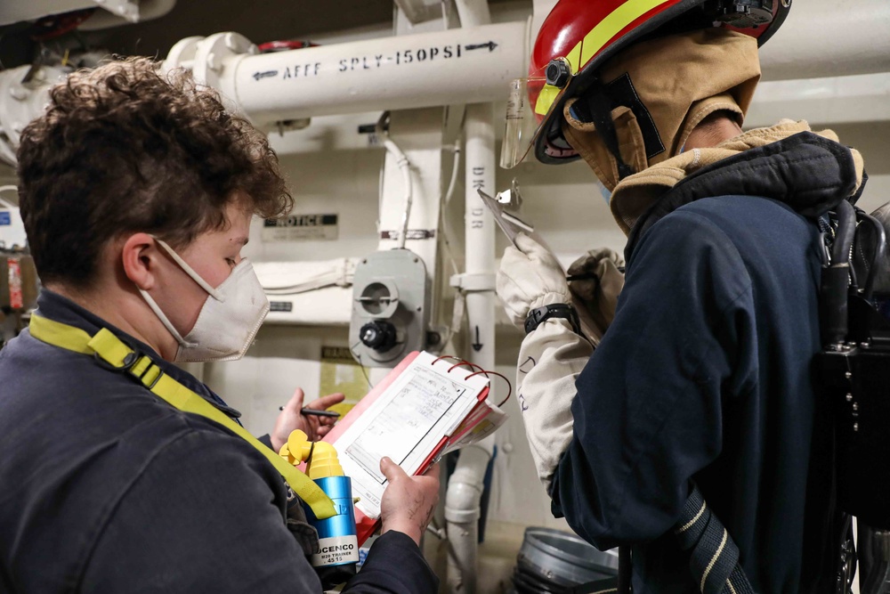 USS Ross Sailors hold main space fire drill