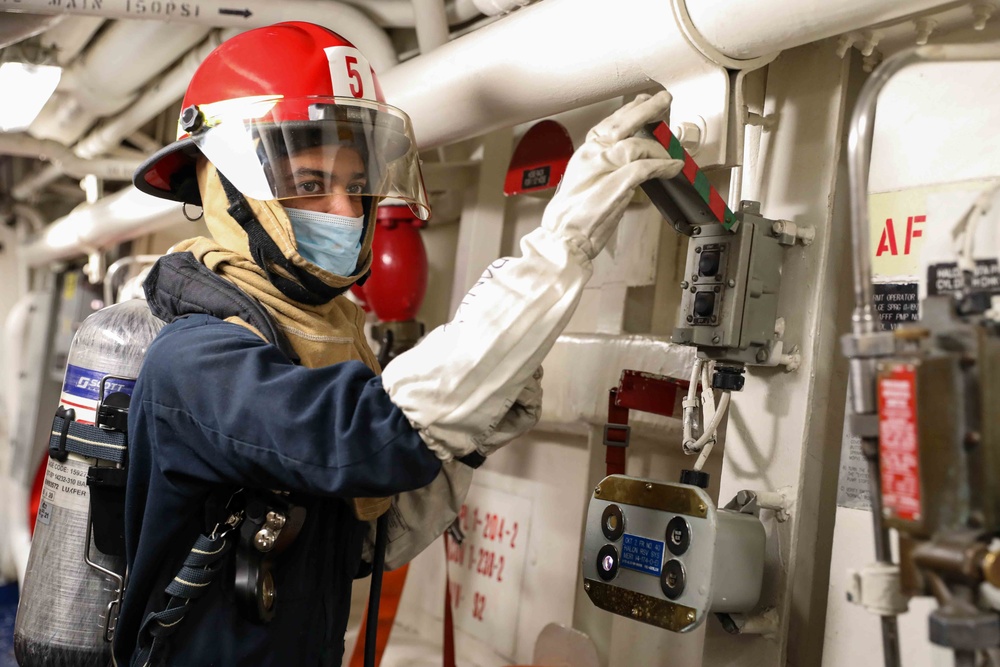 USS Ross Sailors hold main space fire drill