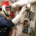USS Ross Sailors hold main space fire drill