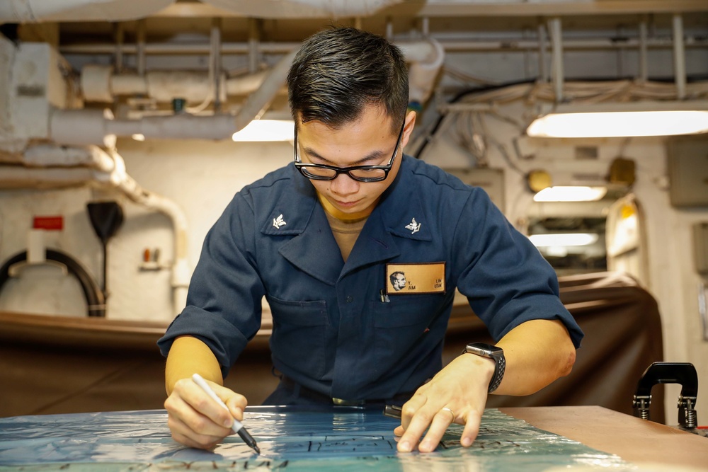 Abraham Lincoln Sailors conduct maintenance