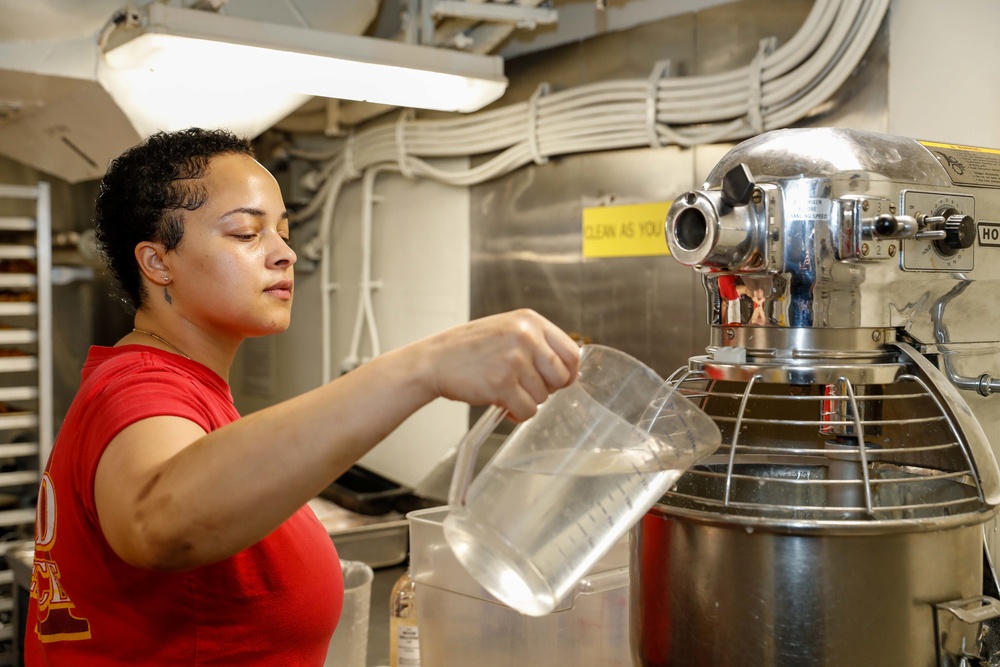 Abraham Lincoln Sailors serve food