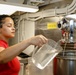 Abraham Lincoln Sailors serve food