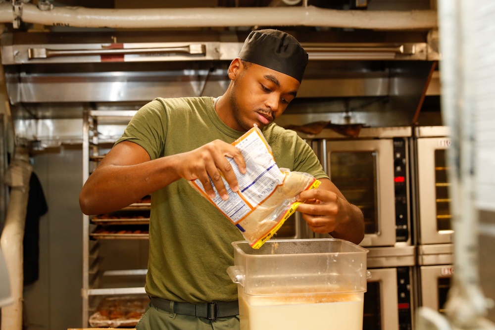 Abraham Lincoln Sailors serve food
