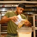 Abraham Lincoln Sailors serve food
