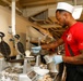 Abraham Lincoln Sailors serve food