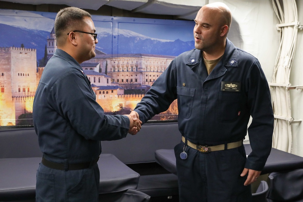 USS Ross Sailor reenlists