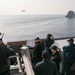 USS Ross replenishes at sea with USNS Robert E. Peary