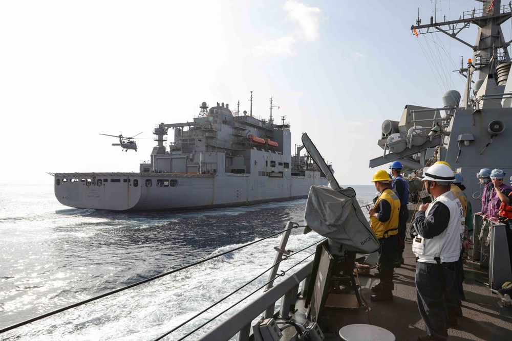 USS Ross replenishes at sea with USNS Robert E. Peary