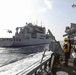 USS Ross replenishes at sea with USNS Robert E. Peary