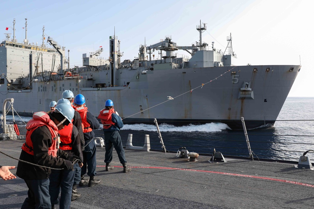 USS Ross replenishes at sea with USNS Robert E. Peary