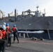 USS Ross replenishes at sea with USNS Robert E. Peary