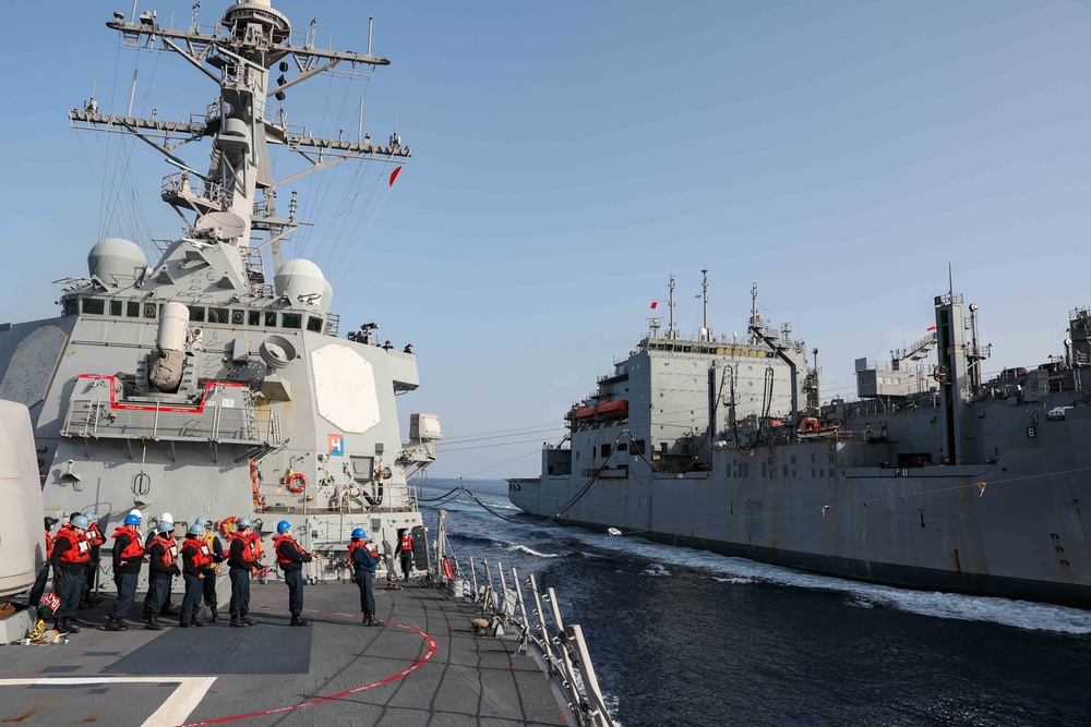 USS Ross replenishes at sea with USNS Robert E. Peary