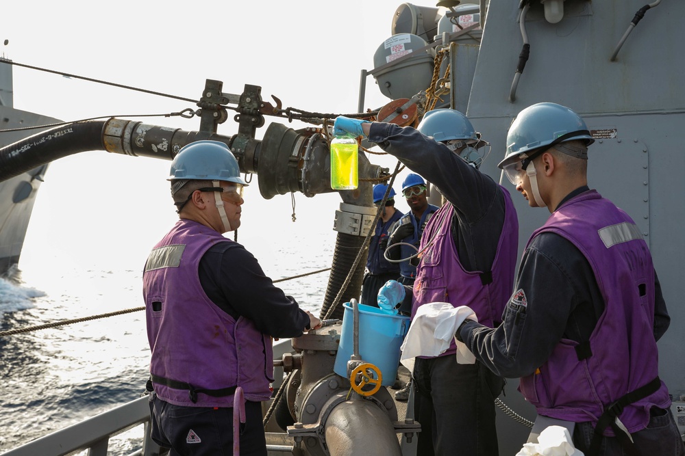 USS Ross replenishes at sea with USNS Robert E. Peary