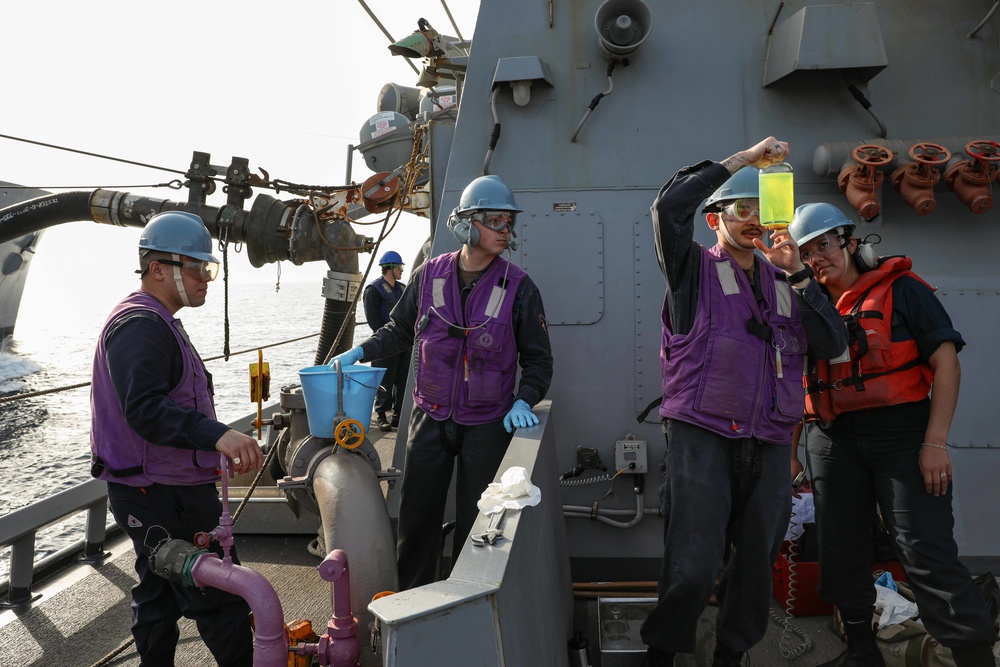 USS Ross replenishes at sea with USNS Robert E. Peary