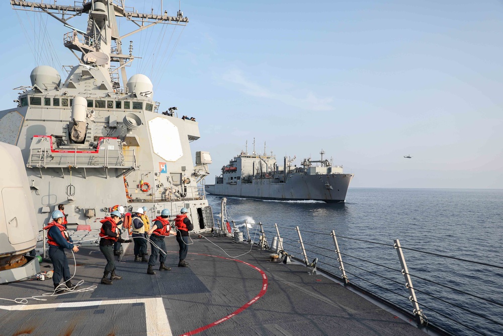 USS Ross replenishes at sea with USNS Robert E. Peary