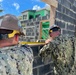 NMCB THREE Seabees measure windowsill at existing police station project