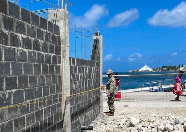 NMCB THREE Seabee measures dimensions for police check point
