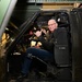 Chef Robert Irvine Receiving a Demonstration of an Blackhawk Simulator