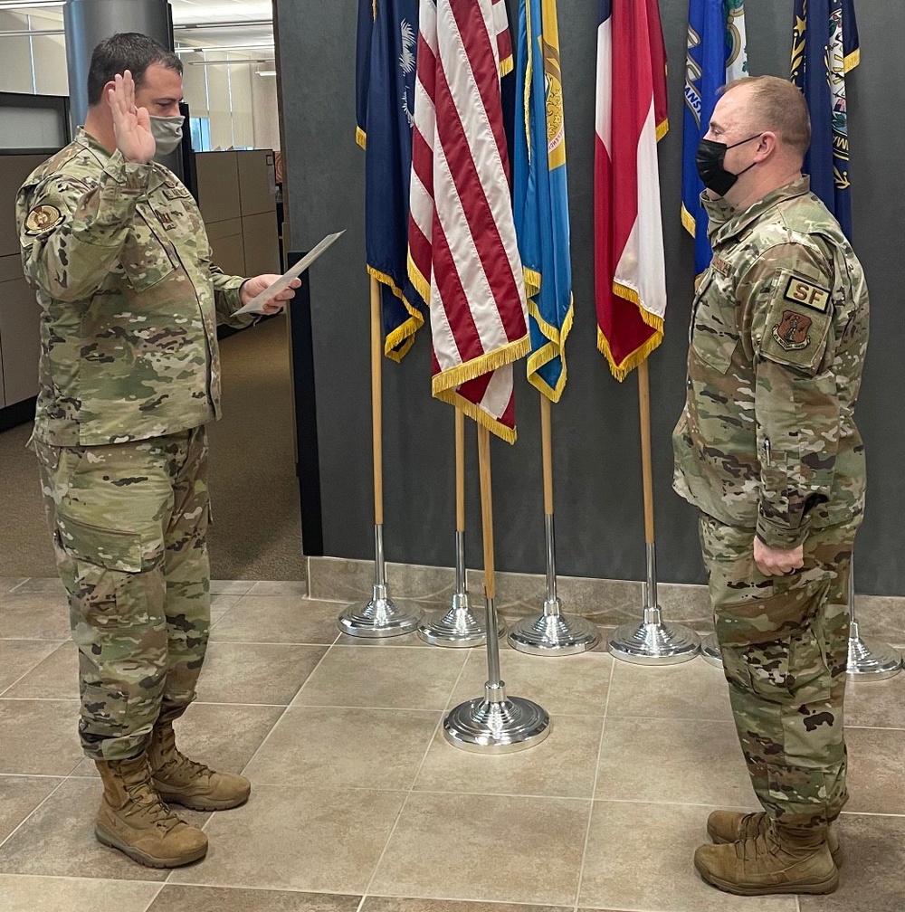 Rude reenlists in New York Air National Guard