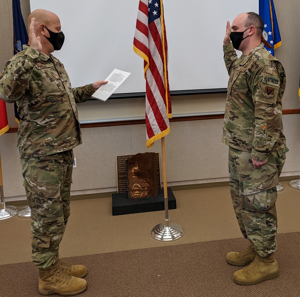 McNamara reenlists in the New York Air National Guard