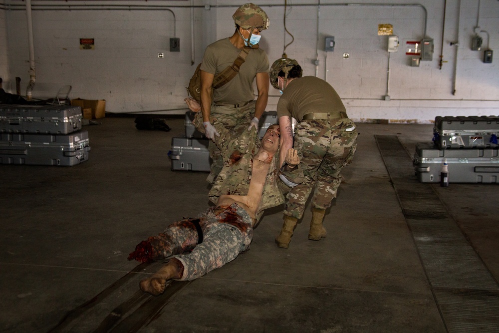 Members form the 382nd Military Police Battalion testing on the Combat Lifesaving skills they just learned.