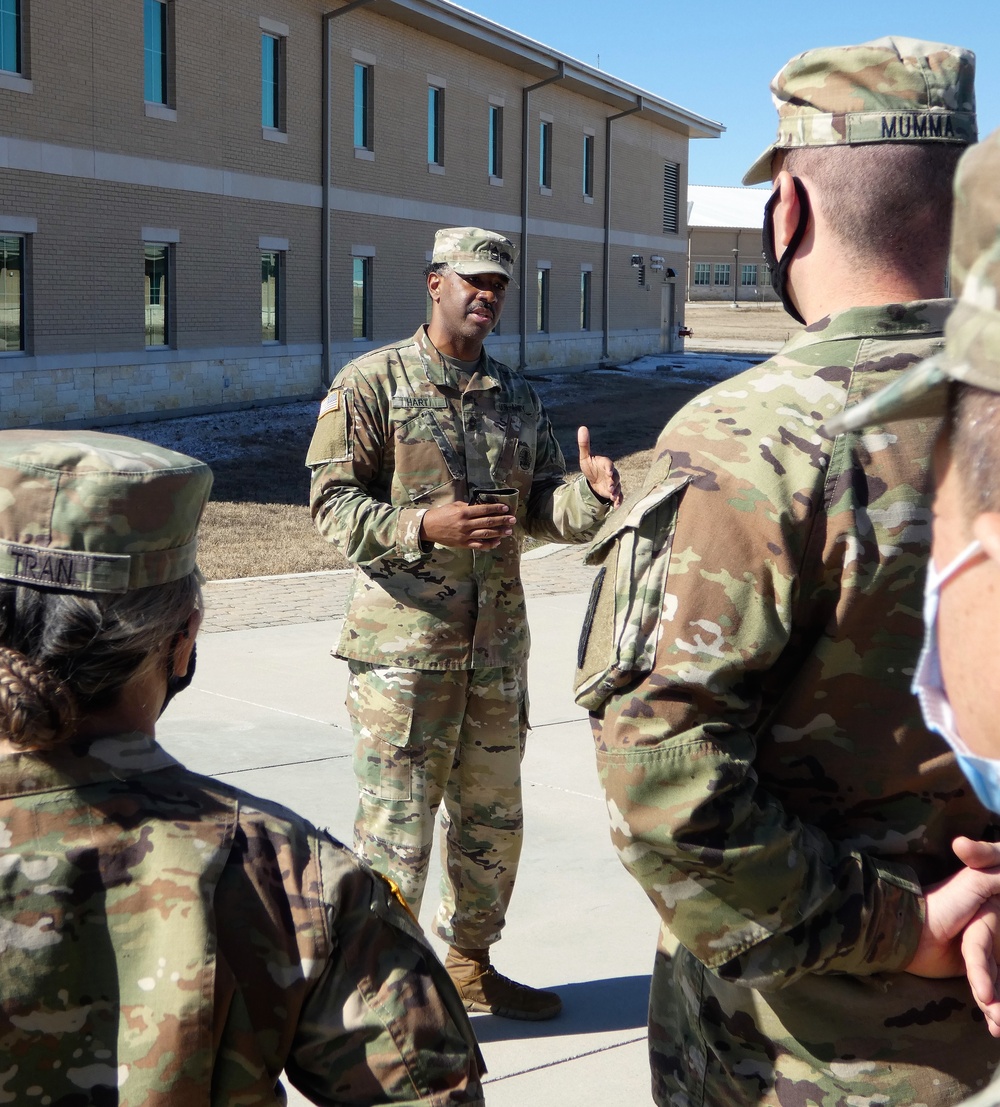 Sgt. Lydia Delgado of the 3D Medical Command (Deployment Support) Det. 11 promoted by friends mentors