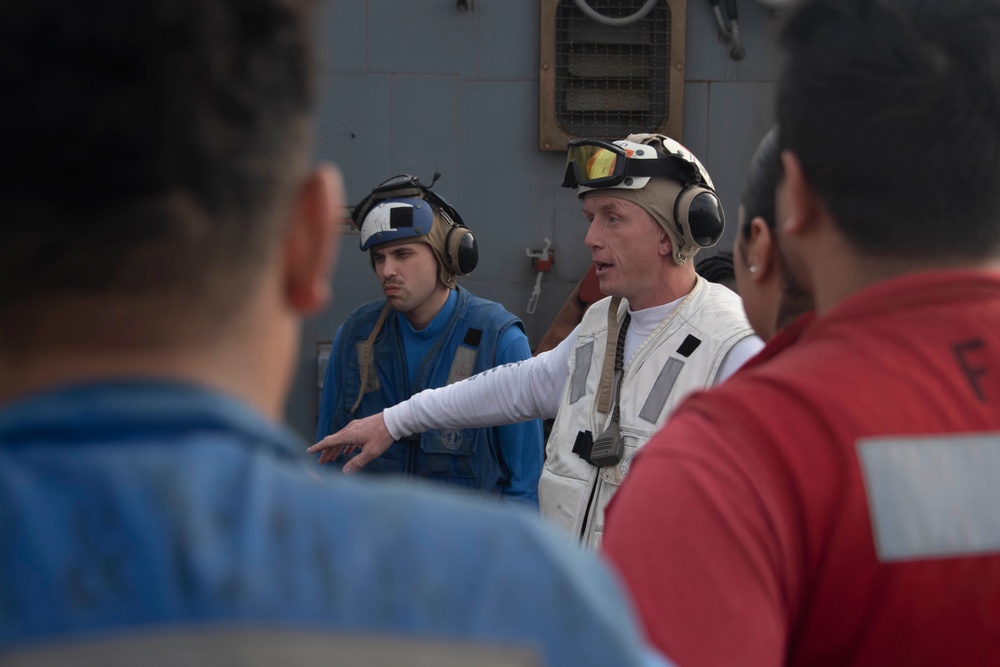 Sailor gives safety brief aboard USS Gonzalez.