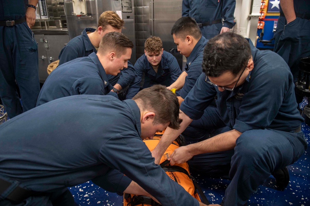 Sailors partake in stretcher bearer training.