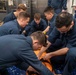 Sailors partake in stretcher bearer training.