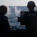 Sailor fires .50-caliber machine gun during a live-fire event aboard USS Gonzalez