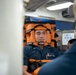 Sailor acts as simulated patient during a stretcher bearer trainign course aboard USS Gonzalez.