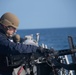 Sailor fires .50-caliber machine gun during a live-fire event aboard USS Gonzalez