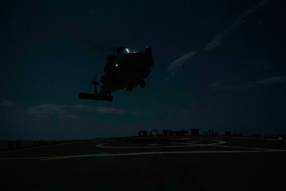 Aircraft comes in to land aboard USS Gonzalez.