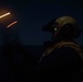 Sailor signals to aircraft aboard USS Gonzalez.