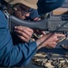 Sailor fires M240B machine gun during a live-fire event aboard USS Gonzalez.